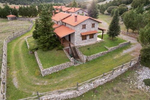 an aerial view of a house on a hill at Mont Valley Boutique Chalets in Arachova