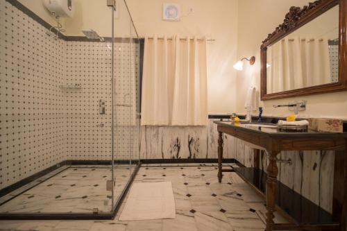 a bathroom with a shower and a sink at Cavalry Villa bikaner in Bikaner