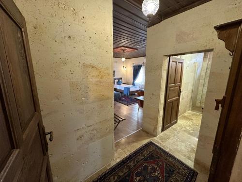 an open door to a hallway with a living room at Virtus Cappadocia Hotel Göreme in Goreme