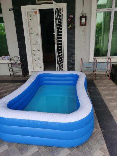 a large inflatable pool in front of a house at DAlyaHomestay in Malacca