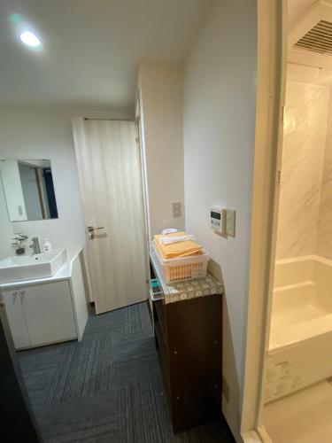 a bathroom with a sink and a counter with a sink at MR TOMO FUJI in Fuji