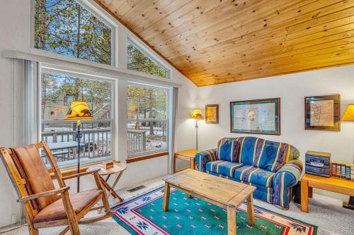 a living room with a couch and a table at Big Leaf - Unit 6 in Sunriver