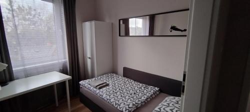 Katil atau katil-katil dalam bilik di Apartament 3 pokoje Poznań