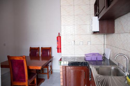 Kuchyň nebo kuchyňský kout v ubytování B I G Residence Hotel