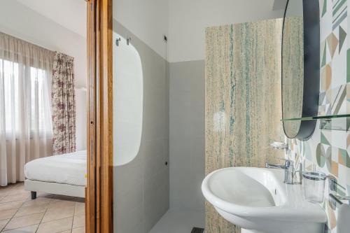 a bathroom with a sink and a mirror at Agriturismo Nonno Luigino in Vico Equense