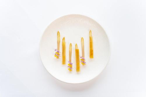 a white plate with four chopsticks on it at Sattlerhof Genießerhotel & Weingut in Gamlitz