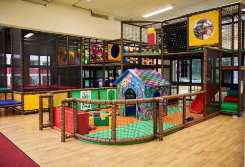 a library with a play room with a playground at Kleinwalsertal Apartment in Mittelberg