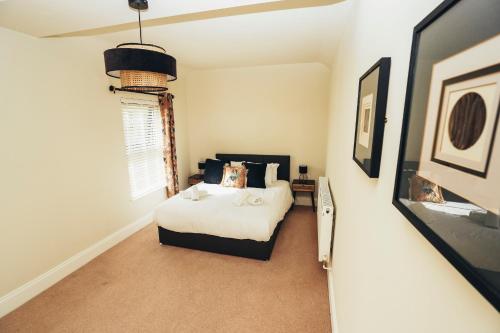 a small bedroom with a bed and a window at Cottages In Derbyshire, The Farm House in Belper