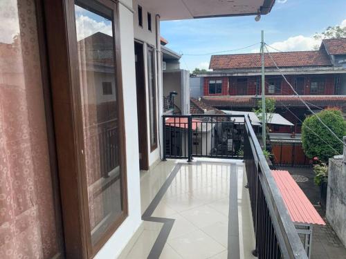 a balcony with a view of a building at Cahaya Residence The Guest House in Kuta