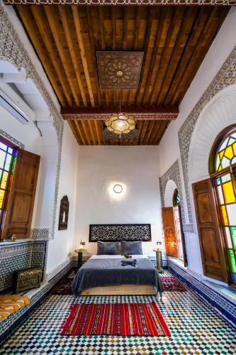 a bedroom with a bed in a room at Palais Chahd Luxury in Fès