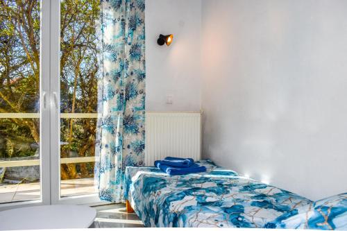 Кровать или кровати в номере Nest View House