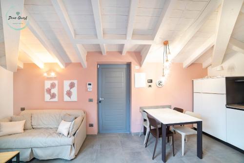 a living room with a couch and a table at Casa sulle Mura in Loano