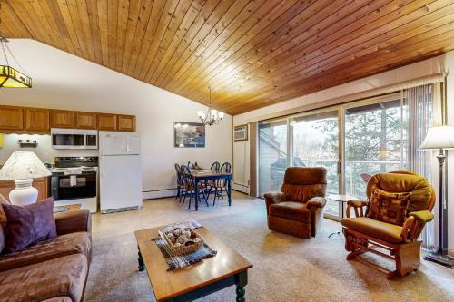 a living room with a couch and a table at Bay Point Hillside 17A Up in Whitefish
