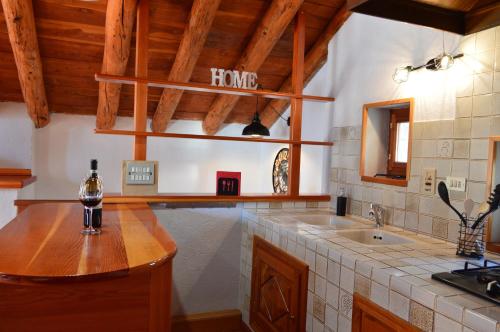 a kitchen with a counter top and a sink at Maison Chez Les Roset in Arvier