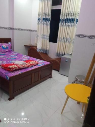 Кровать или кровати в номере Nhà nghỉ VIP 92