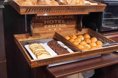 a tray of various types of bread and pastries at Casona Plaza Hotel Centro in Puno
