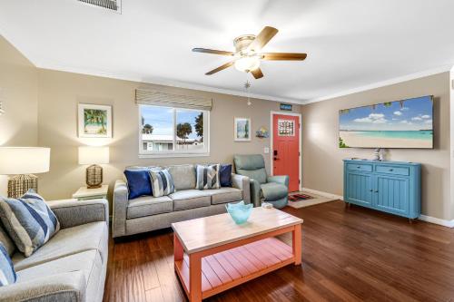 a living room with two couches and a ceiling fan at Minutes to Manasota Beach 2 King Beds Fenced yard Pets Welcome in Englewood
