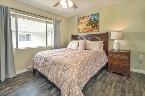 a bedroom with a bed and a window at Ko Olina Fairways #4E townhouse in Kapolei