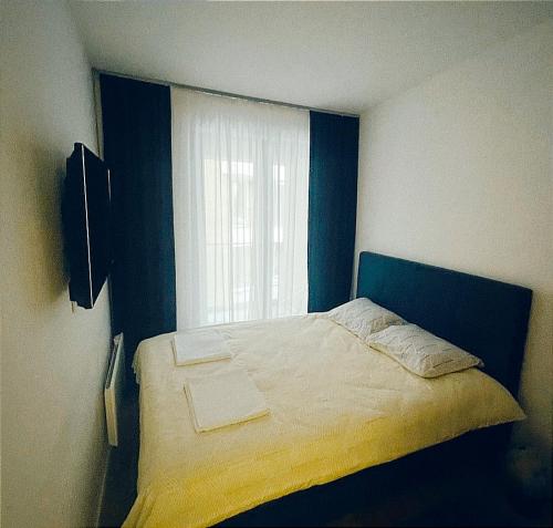 En eller flere senger på et rom på Apartman 34