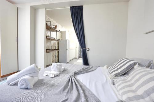 a bedroom with a bed with towels on it at Les Suites in Santa María de Palautordera