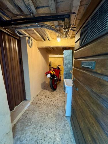 a motorcycle parked in a room with a hallway at Il Pentolo in Sansepolcro