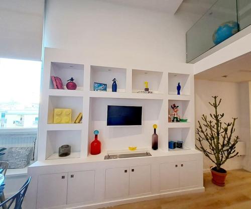 TV a/nebo společenská místnost v ubytování Le Dimore Dell’Artista