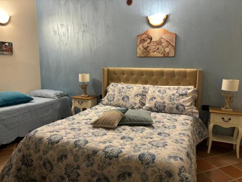 a bedroom with a bed with a pillow on it at La Scala di Atena in Agrigento