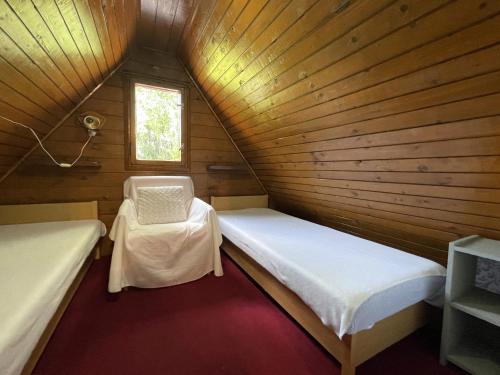 Postel nebo postele na pokoji v ubytování Nyírfa vendégház