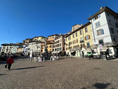 a person walking down a street in a city at Casa Beccarie in Lovere