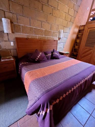 Postel nebo postele na pokoji v ubytování Hotel Casa Valle