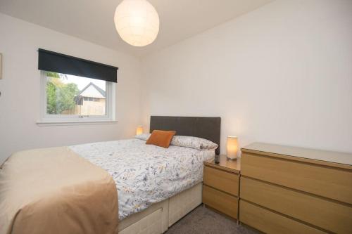 En eller flere senge i et værelse på Elgin, home from home