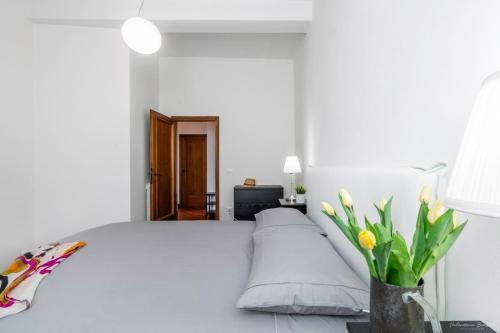 Un pat sau paturi într-o cameră la Casa tua Santo Spirito