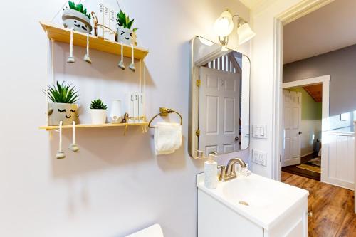 a bathroom with a sink and a mirror at Summit House in Windsor