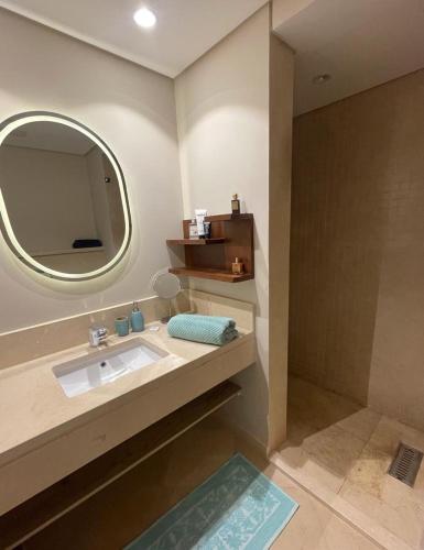 a bathroom with a sink and a mirror at El Gouna Mangroovy 2Bd - M10 in El Gouna