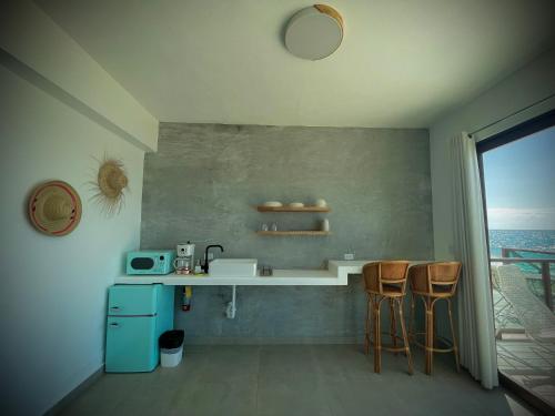 Köök või kööginurk majutusasutuses 1 Corcega Beachfront Suites
