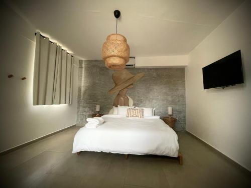 Voodi või voodid majutusasutuse 1 Corcega Beachfront Suites toas