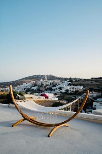 a hammock on top of a building with a city at Canava Villas #3 in Santorini in Emporio Santorini
