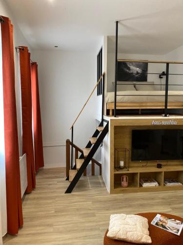a living room with a bunk bed and a staircase at Athéna in Caen
