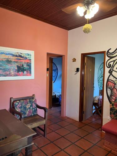 a living room with a couch and a chair at Mare Azzurro Praia do Itagua in Ubatuba