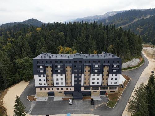 an aerial view of a building in the mountains at Apartments Natalija - Zlatni Javor in Jahorina