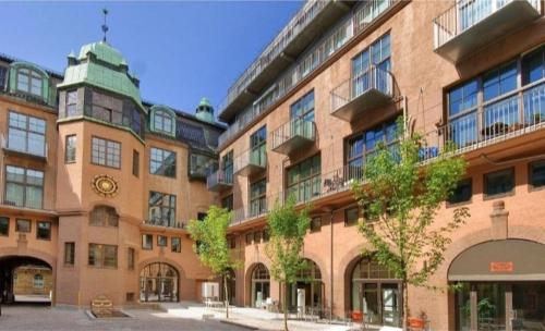 a large brick building with a clock on it at Downtown Elegance in Oslo