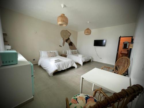 Voodi või voodid majutusasutuse 1 Corcega Beachfront Suites toas