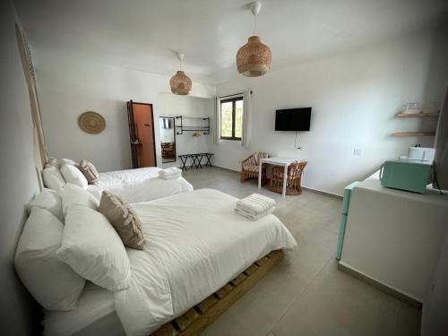 Voodi või voodid majutusasutuse 1 Corcega Beachfront Suites toas