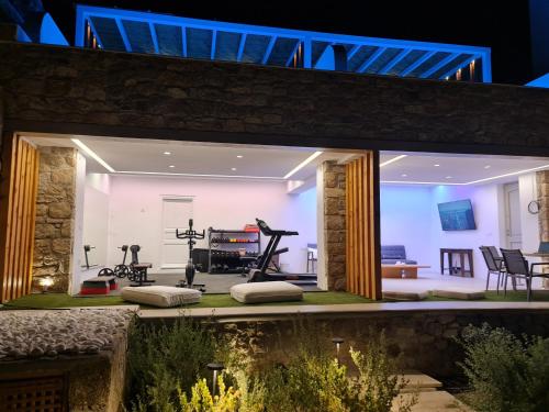 an indoor gym with exercise equipment in a house at VILLA PANAMERA Mykonos, Private Heaven, Supreme View! in Fanari