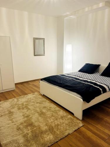 Un pat sau paturi într-o cameră la Moderne & Chaleureux - Grand Parking Gratuit