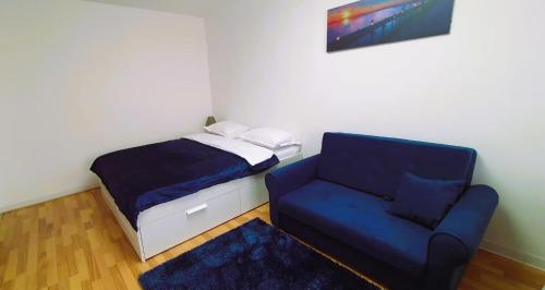 a small bedroom with a bed and a chair at Casa Rusu - Govandari -Self check in-24h in Reşiţa