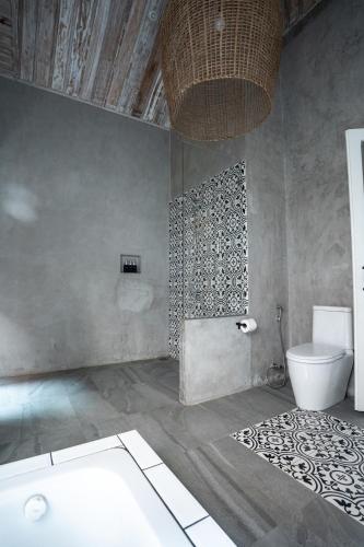 a bathroom with a toilet and a sink at Chic stay HANA Boutique hotel in Luang Prabang
