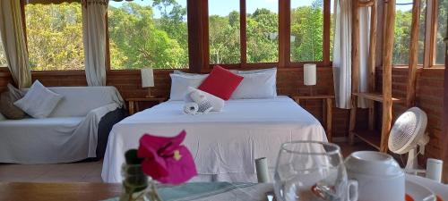 Una cama o camas en una habitación de Pousada Chalé Cantinho Verde