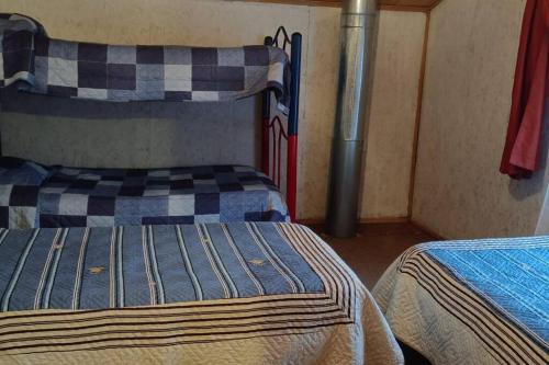 Poschodová posteľ alebo postele v izbe v ubytovaní cabañas mateo 01