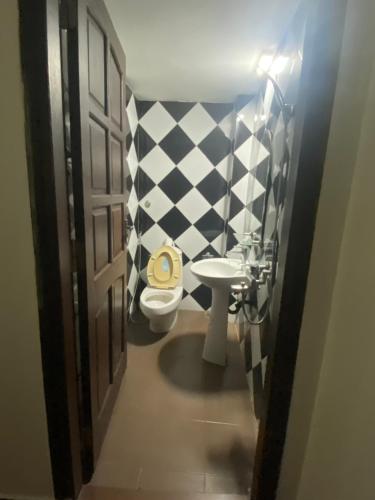 a bathroom with a toilet and a sink at 305HA Gest house in Ninh Binh